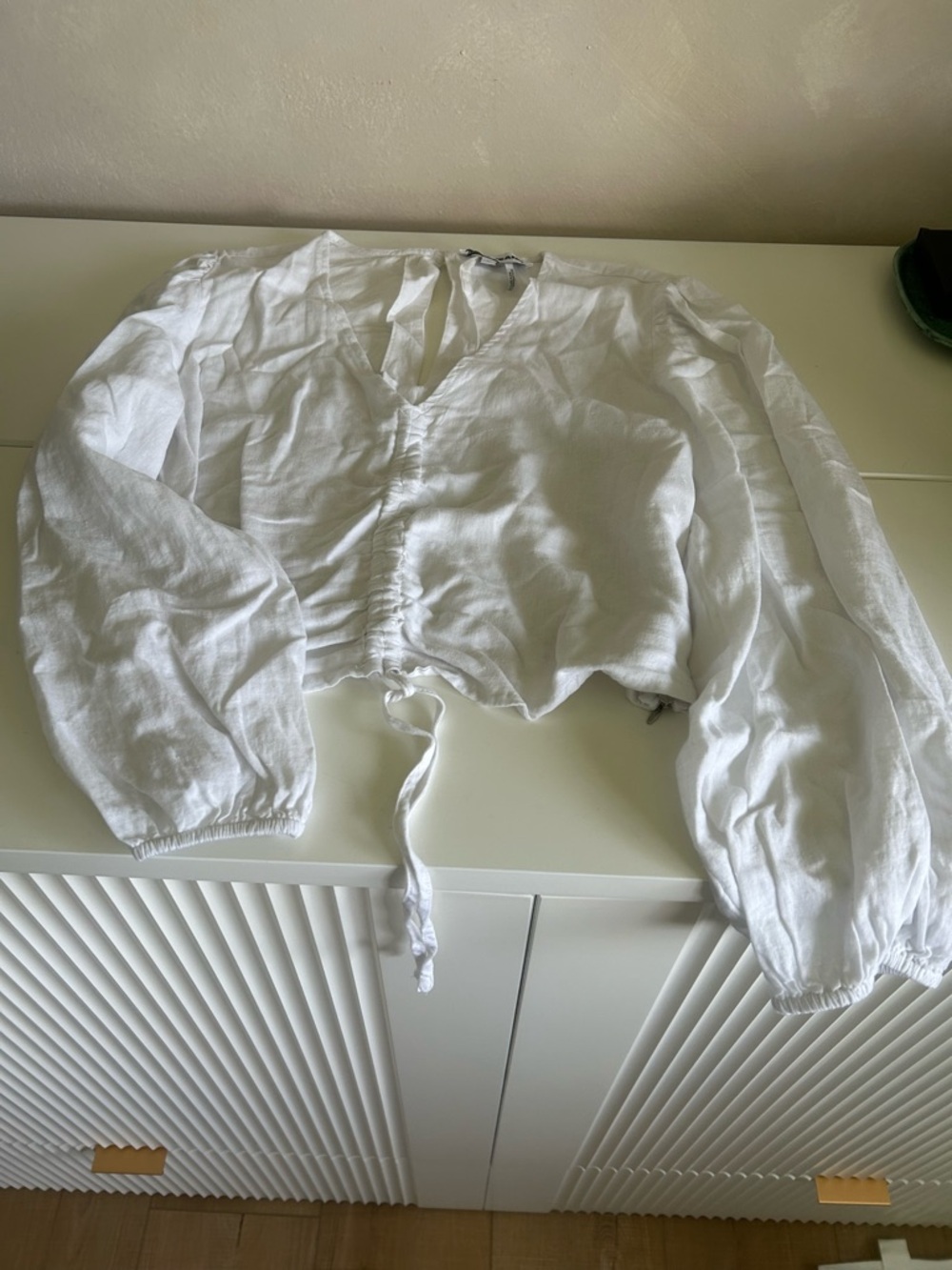 Waist length White Drawstring Long-Sleeve top